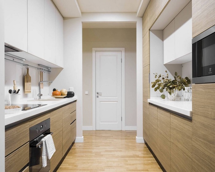 Если нужна дополнительная комната, сделайте кухню в коридоре. / Фото: almode.ru