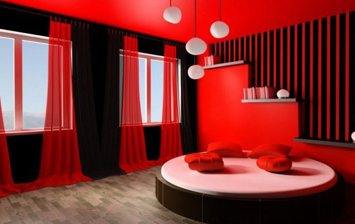 Чёрно-красная спальня с круглой кроватью