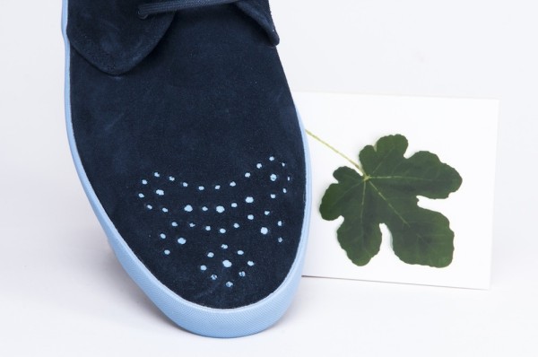 Перфорат в форме листа смоковницы на передней части дизайнерской обуви.