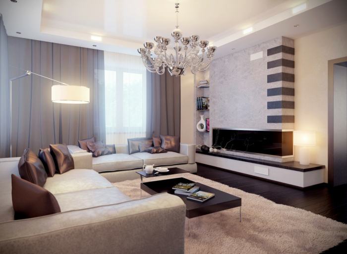 Гостиная комната с двумя мягкими диванчиками, оригинальными серыми шторами, хромированной люстрой и чёрным матовым журнальным столиком.