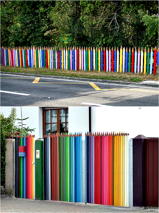 забор цветных карандашей. забор в саду разноцветных досок в виде карандашей