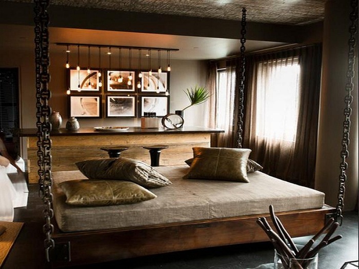 Красивая современная спальня со стильной подвесной кроватью и освещением пропитанным прохладой.