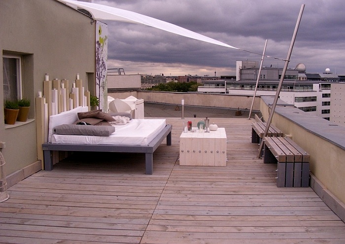 Оптимальный вариант оформления места для отдыха на крыше дома создаст теплую атмосферу.