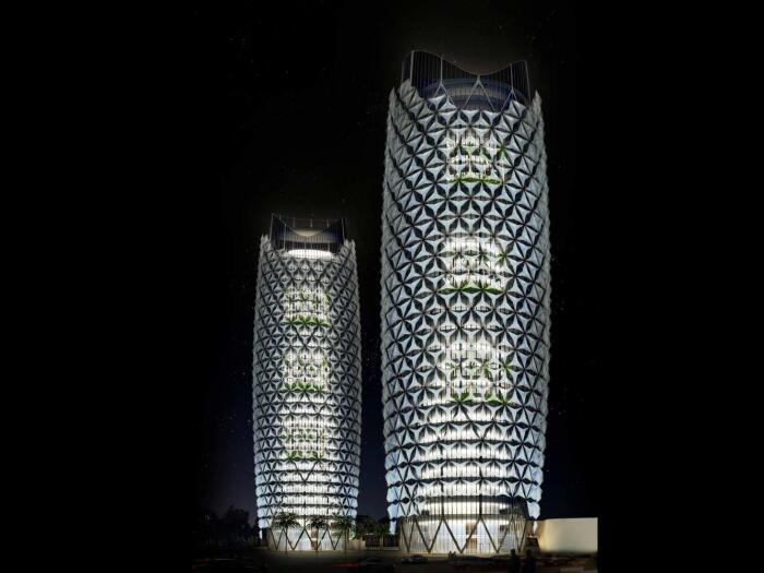 В вечернее время сложенные лепестки «цветы» открывают стеклянный фасад зданий оголяя внутреннее пространство (Al Bahar Towers, Абу-Даби). | Фото: chi-athenaeum.org.