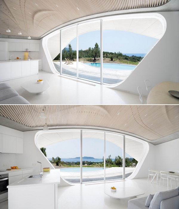 Большие окна обеспечивают панорамный вид на залив (Villa Ypsilon, Греция).
