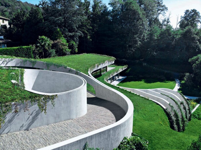Органичные формы двухуровневой резиденции повторяют очертания природного склона (Atelier Alice Trepp, Швейцария). | Фото: architectureprize.com.