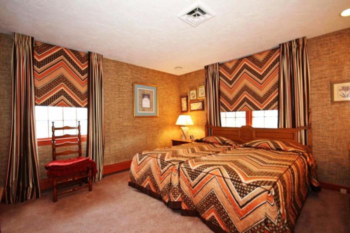 Одна из спальных комнат оформлена в коричнево-оранжевых тонах (ретро-дом в Фрамингеме, США). | Фото: nsmbl.nl.